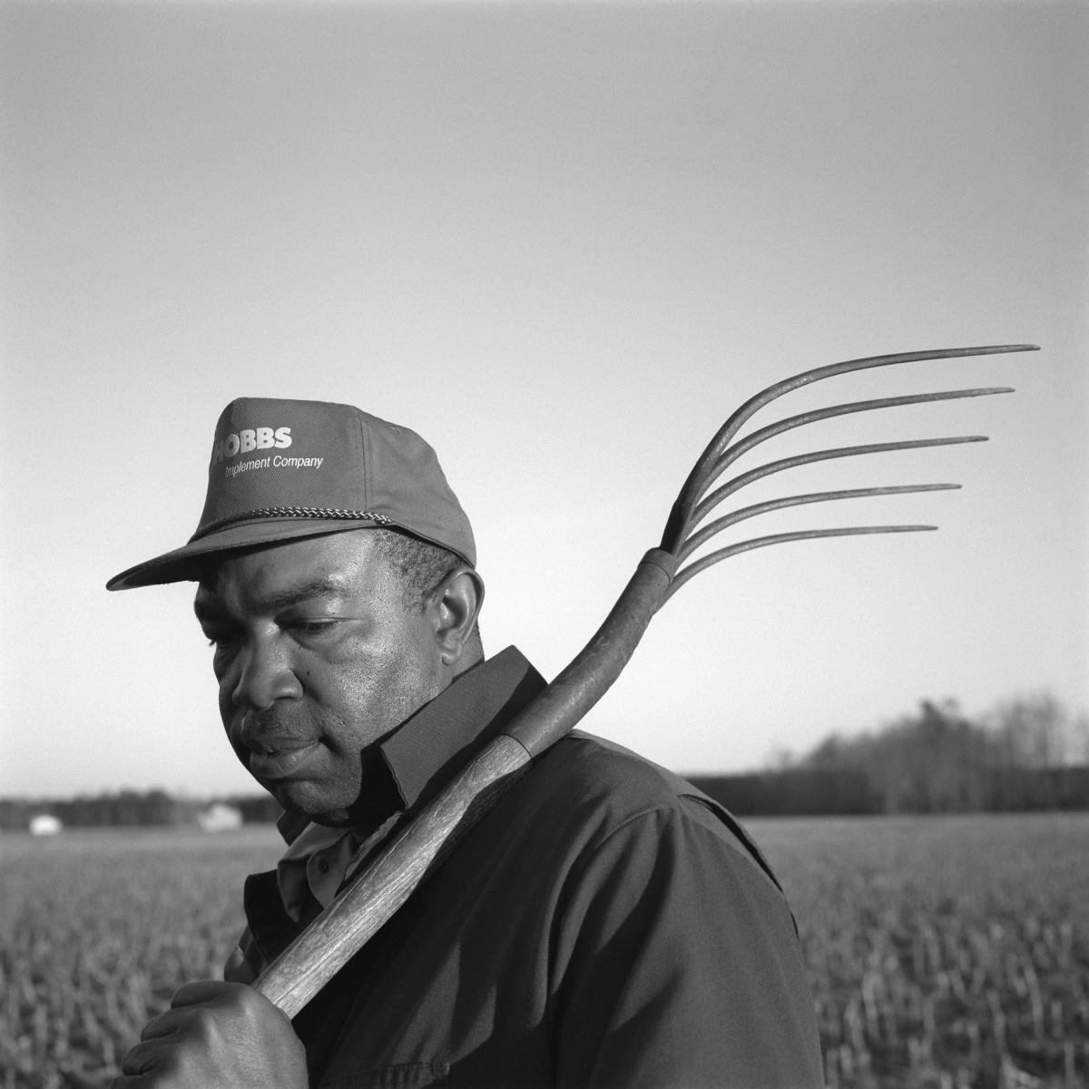 <p><center>Martin County, North Carolina:</center></p>
Herman Lynch worked on his grandfather's farm for many years, until the older man died. Because of legal problems with the farm's deed, the land was sold to a neighboring farmer. Lynch now tends his grandfather's land as hired help. : Images : AMERICAN BLACK FARMERS PROJECT - John Ficara