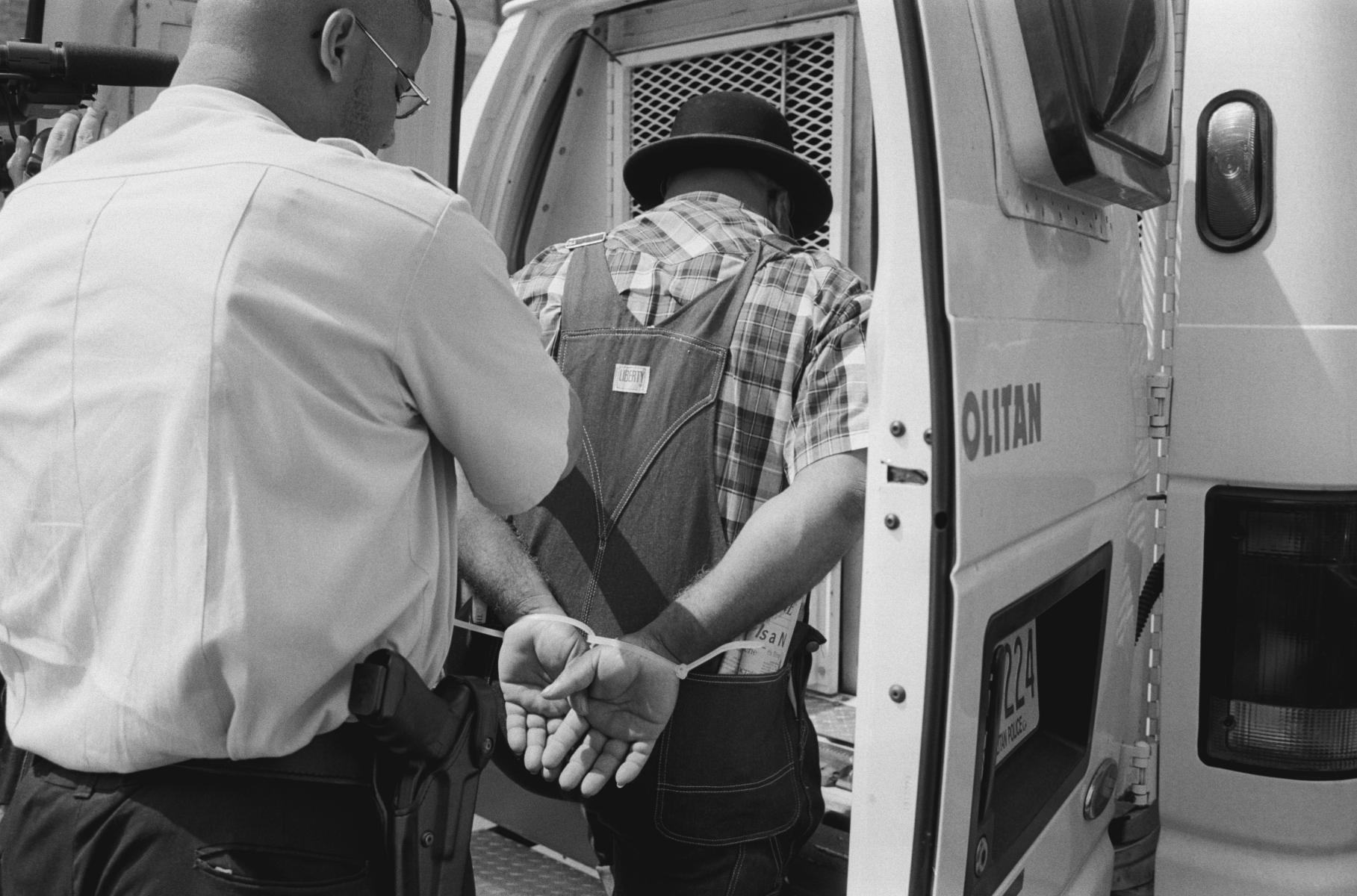 <p><center>Washington, D.C.:</center></p>
A black farmer is arrested during a peaceful sit-down demonstration in front of the Dept. of Agriculture. : Images : AMERICAN BLACK FARMERS PROJECT - John Ficara