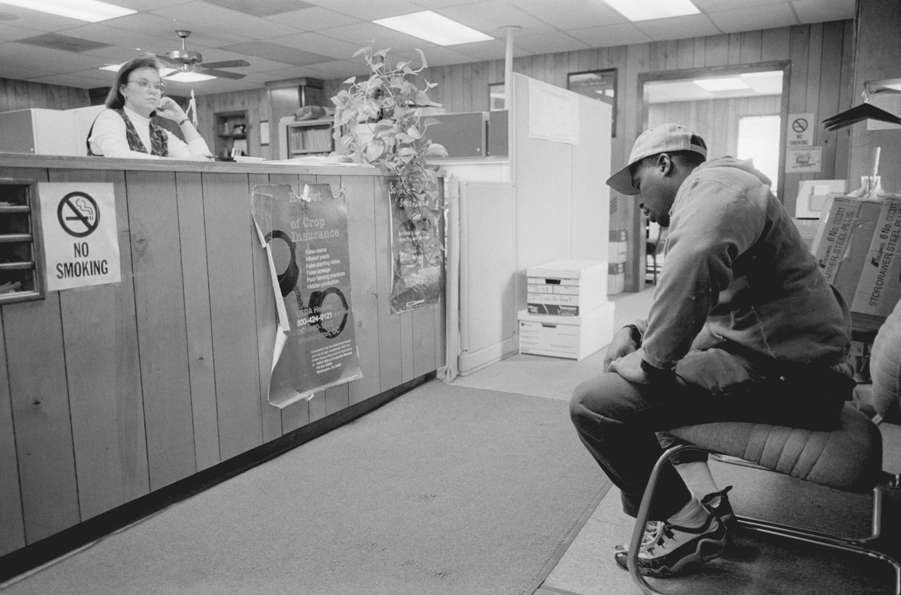 <p><center>Holmes County, Mississippi:</center></p>
Joshua Davis waits to meet with a USDA official at the local office; the official never showed up, and Davis left after having sat for forty-five minutes. : Images : AMERICAN BLACK FARMERS PROJECT - John Ficara