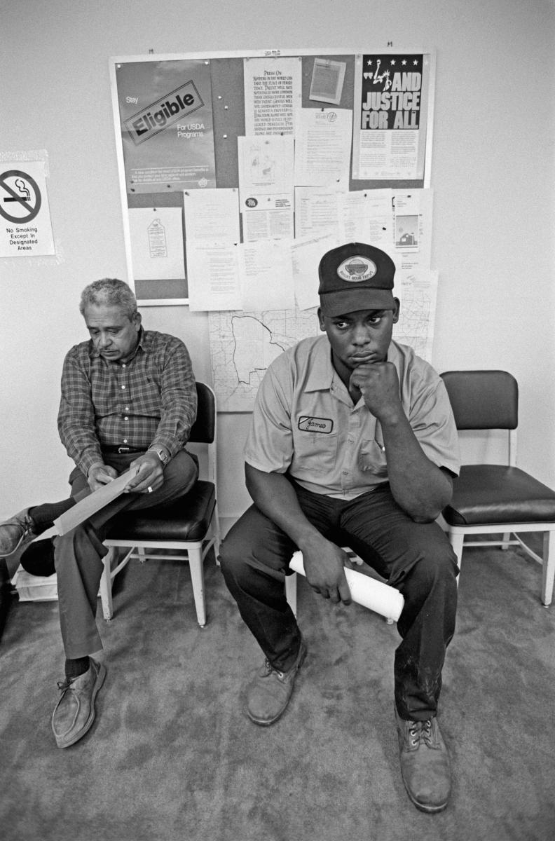 <p><center>Thomas County, Georgia:</center></p>
Gene Cummings, a caseworker for the Federation of Southern Cooperatives, and James Marable sit in the waiting room prior to meeting with local USDA official about securing a loan that will keep Marable Farm operating. : Images : AMERICAN BLACK FARMERS PROJECT - John Ficara