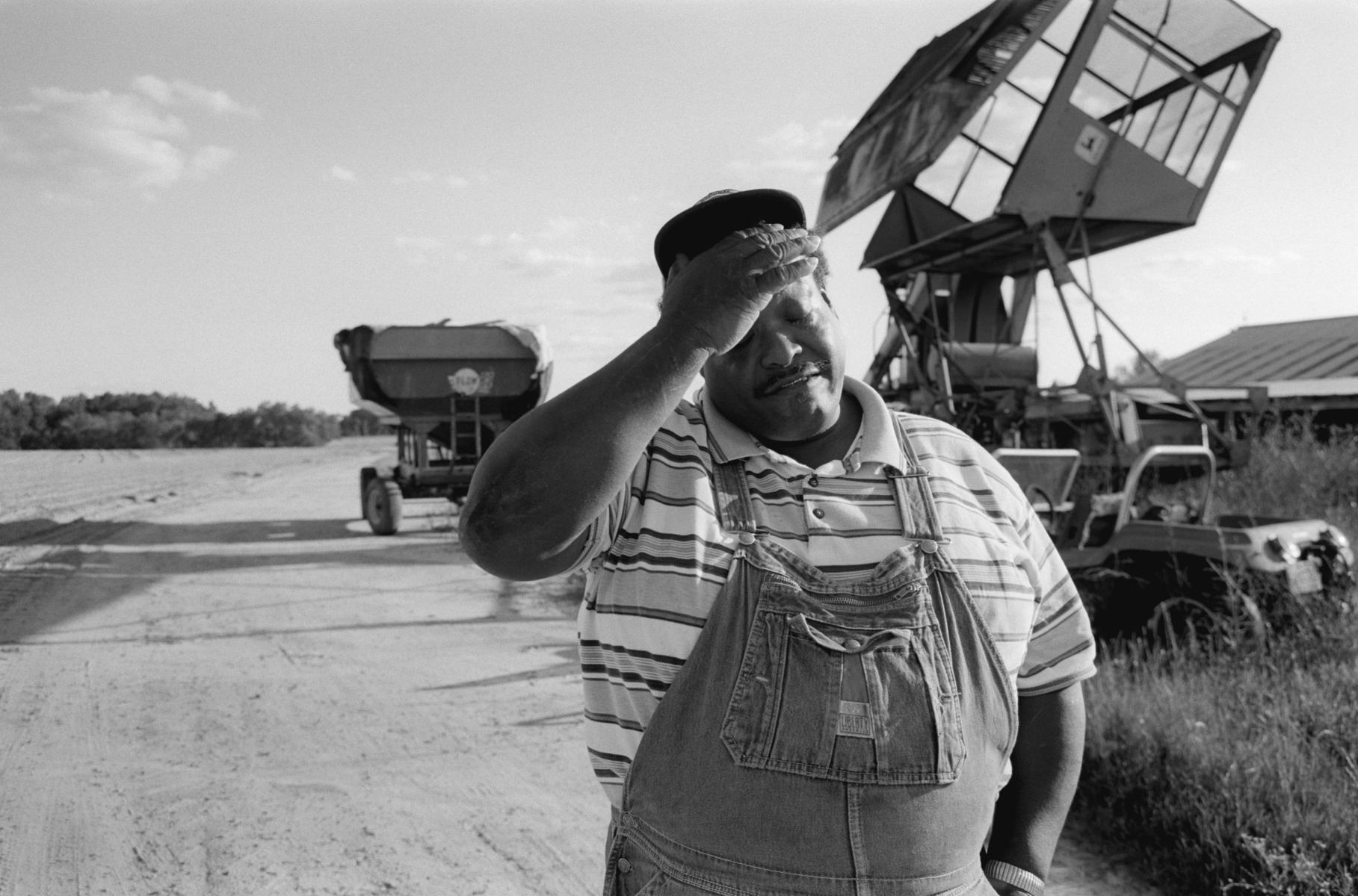 <p><center>Dooly County, Georgia:</center></p>
Carl Whitehead shows strain and frustration as the window of opportunity to plant his cotton seeds has come and gone. Having submitted his application for and operational loan on time and required before planting season, he can only wait, even as other farmers who requested the same loans at the same time have already received their money purchased and planted their seeds weeks ago. He filed for bankruptcy and will be the last generation in his family to farm. : Images : AMERICAN BLACK FARMERS PROJECT - John Ficara